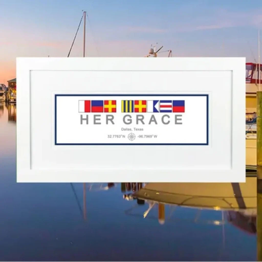 Framed nautical signal flags reading HER GRACE